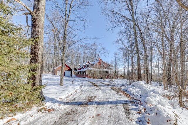 143 Cathleen Dr, East Stroudsburg, PA 18302 - yard covered in snow featuring a garage