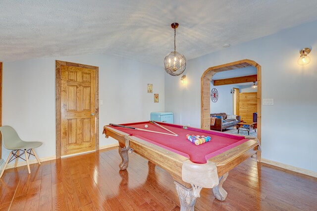 143 Cathleen Dr, East Stroudsburg, PA 18302 - recreation room featuring vaulted ceiling, arched walkways, wood-type flooring, billiards table, and baseboards