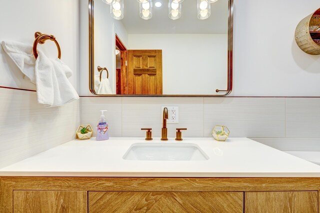 143 Cathleen Dr, East Stroudsburg, PA 18302 - bathroom with vanity and tasteful backsplash