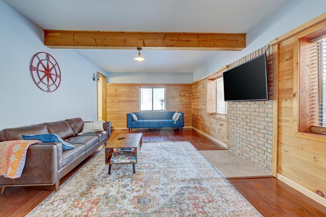 143 Cathleen Dr, East Stroudsburg, PA 18302 - living room with hardwood / wood-style floors, beam ceiling, wood walls, and baseboards