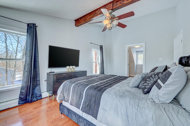 143 Cathleen Dr, East Stroudsburg, PA 18302 - bedroom with wood finished floors, beam ceiling, and a ceiling fan