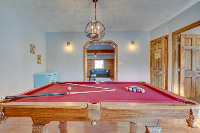 143 Cathleen Dr, East Stroudsburg, PA 18302 - recreation room featuring pool table, a textured ceiling, arched walkways, wood finished floors, and a chandelier