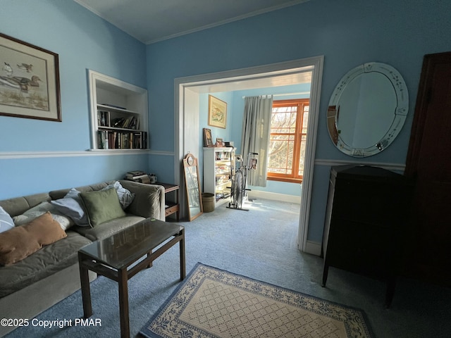 carpeted living room with crown molding and baseboards