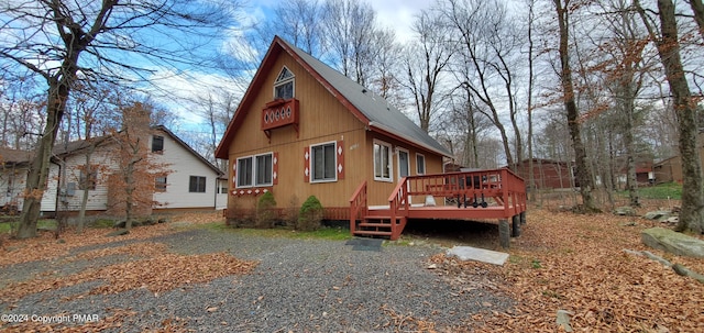 view of side of property featuring a deck