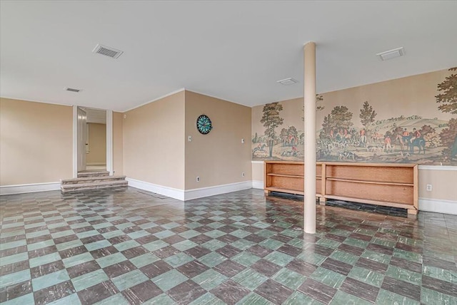 interior space featuring tile patterned floors, visible vents, and baseboards