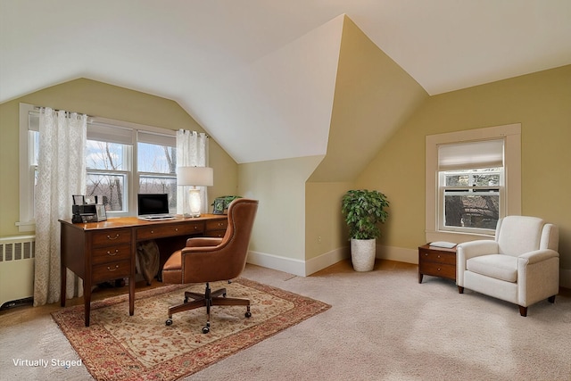 office space with radiator heating unit, baseboards, carpet flooring, and lofted ceiling