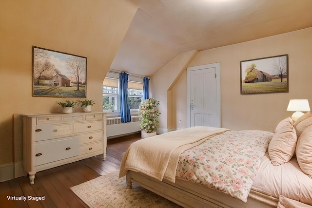 bedroom featuring radiator heating unit, lofted ceiling, and dark wood-style flooring