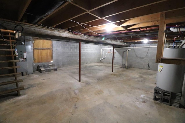 unfinished below grade area featuring water heater