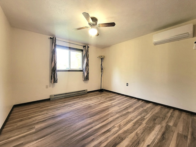 157 Seminole Trl, Tobyhanna, PA 18466 - empty room with a wall unit AC, baseboard heating, wood finished floors, a ceiling fan, and baseboards