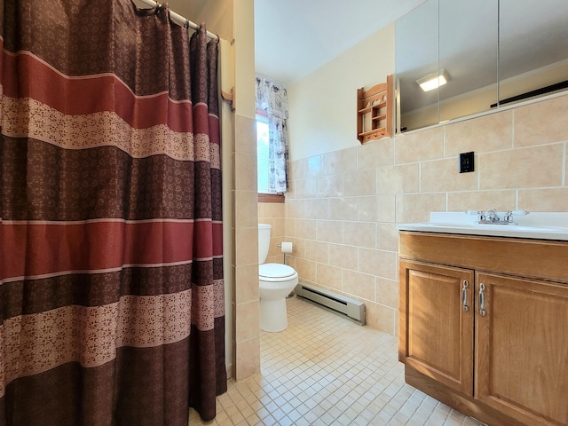 157 Seminole Trl, Tobyhanna, PA 18466 - bathroom with a baseboard radiator, tile walls, vanity, toilet, and tile patterned flooring