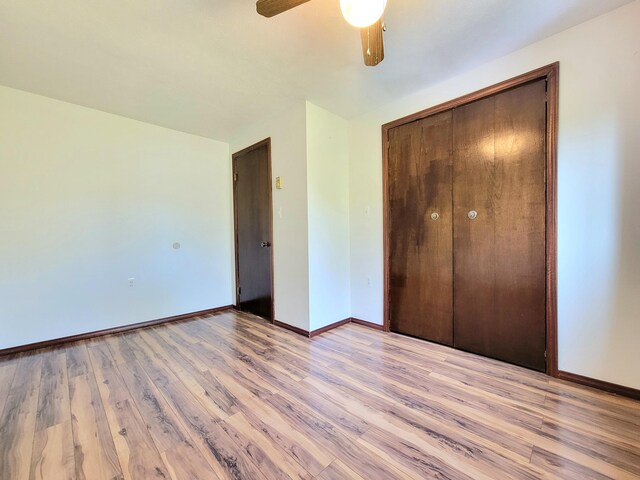 157 Seminole Trl, Tobyhanna, PA 18466 - unfurnished bedroom featuring baseboards, light wood-style flooring, a closet, and ceiling fan