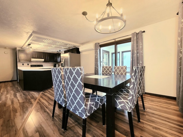 157 Seminole Trl, Tobyhanna, PA 18466 - dining space with wood finished floors, a chandelier, and baseboards