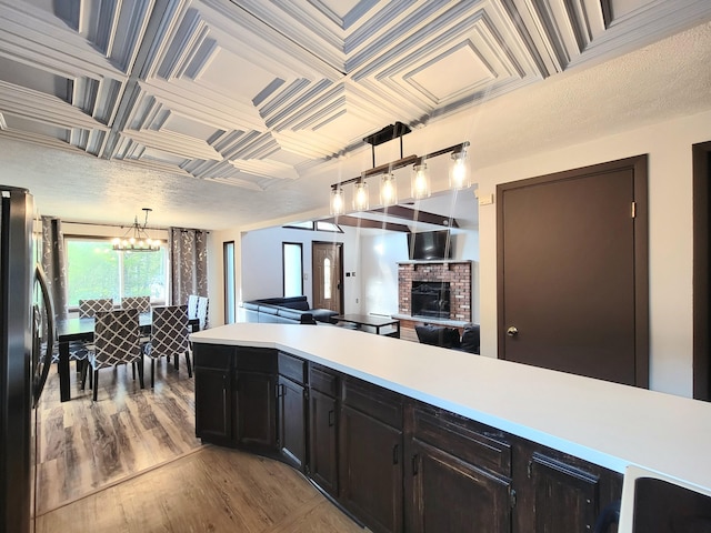 157 Seminole Trl, Tobyhanna, PA 18466 - kitchen featuring freestanding refrigerator, light countertops, wood finished floors, open floor plan, and a chandelier