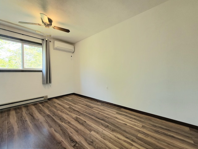 157 Seminole Trl, Tobyhanna, PA 18466 - unfurnished room with a wall mounted AC, dark wood finished floors, ceiling fan, a baseboard heating unit, and baseboards