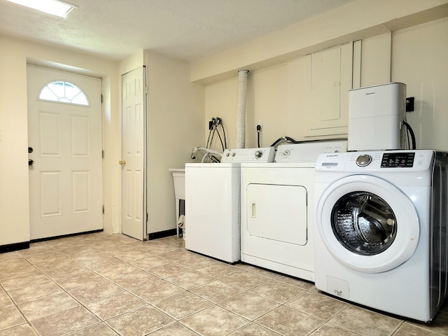 157 Seminole Trl, Tobyhanna, PA 18466 - laundry area with independent washer and dryer, light tile patterned floors, and baseboards