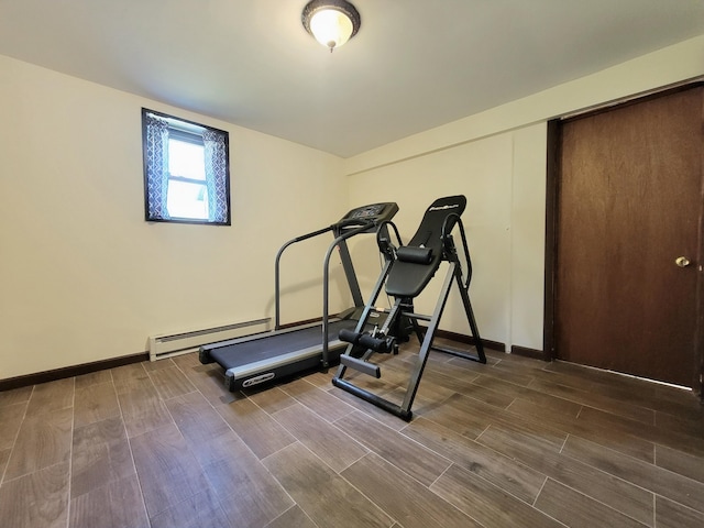 157 Seminole Trl, Tobyhanna, PA 18466 - exercise room featuring a baseboard heating unit, wood finished floors, and baseboards