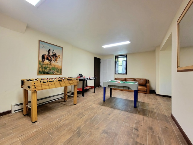 157 Seminole Trl, Tobyhanna, PA 18466 - recreation room with wood finished floors, baseboards, and a baseboard heating unit