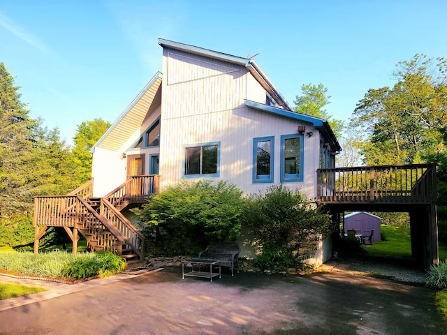 157 Seminole Trl, Tobyhanna, PA 18466 - rear view of property featuring stairway, a deck, and a patio