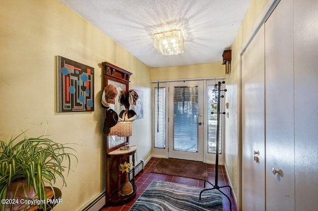 doorway to outside featuring baseboards, a healthy amount of sunlight, a baseboard radiator, and tile patterned floors