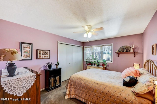 bedroom featuring carpet floors, a closet, ceiling fan, and a textured ceiling