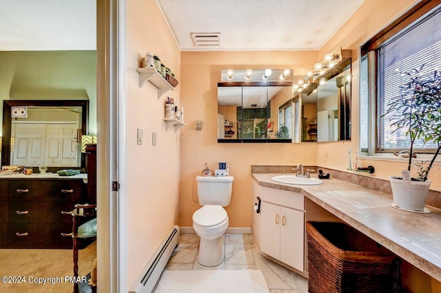 bathroom featuring toilet, vanity, visible vents, marble finish floor, and baseboard heating