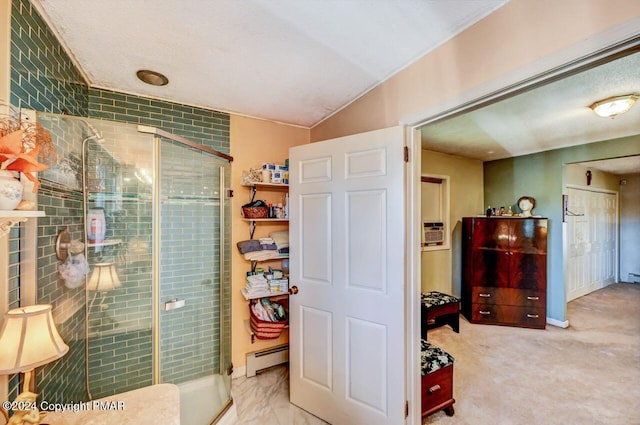 full bathroom featuring lofted ceiling, a shower stall, a baseboard heating unit, and baseboards