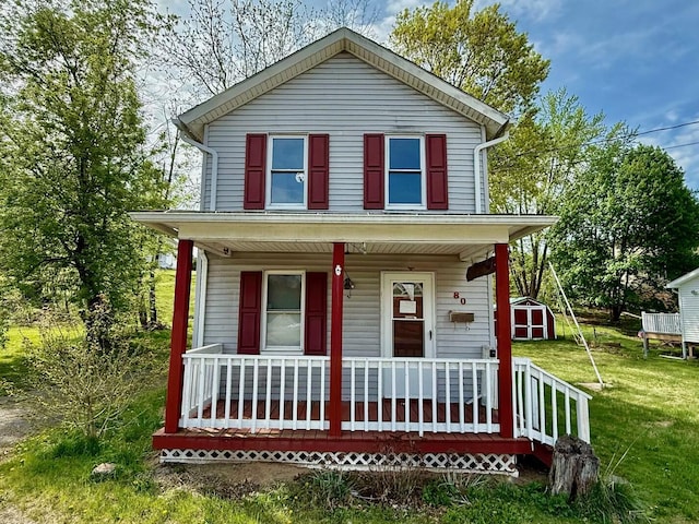 80 Parsonage St Rear, Rear, Pittston, PA 18640 - view of front facade with a porch, a storage shed, a front yard, and an outbuilding