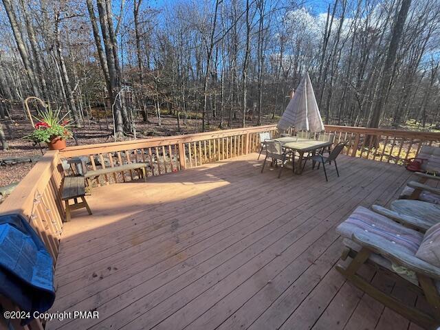 deck featuring outdoor dining space