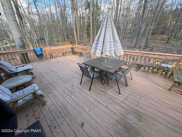 deck with outdoor dining area