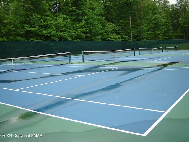 view of sport court with fence