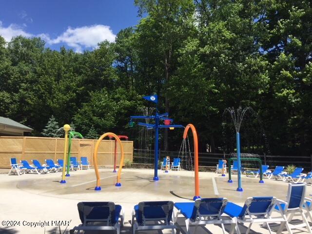 communal playground featuring fence