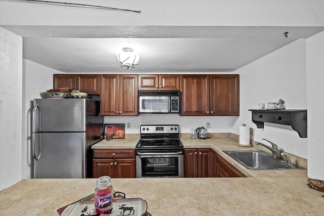 57 Red Fox Ct, Lake Harmony, PA 18624 - kitchen featuring light countertops, a sink, and appliances with stainless steel finishes
