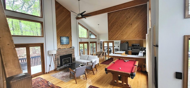 game room featuring high vaulted ceiling, french doors, billiards, wood finished floors, and ceiling fan