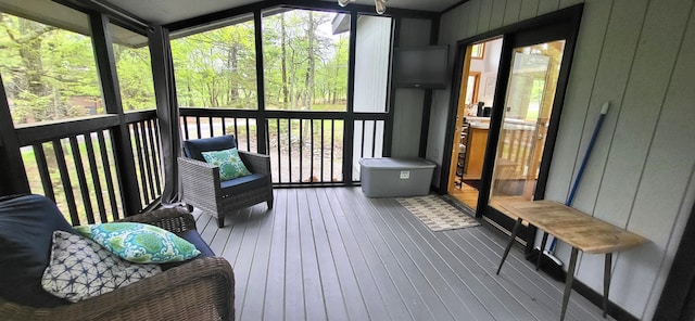 sunroom / solarium with healthy amount of natural light and vaulted ceiling