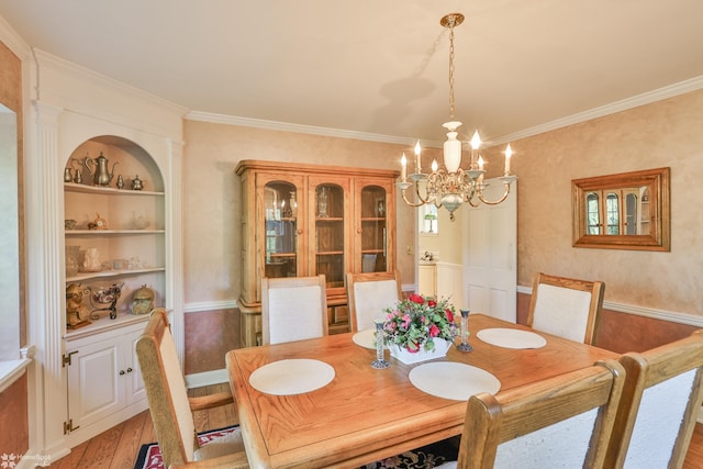 2711 Main St, Bethlehem, PA 18017 - dining space with a chandelier, light wood-type flooring, crown molding, and built in shelves