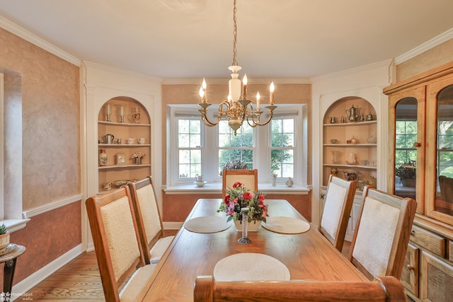 2711 Main St, Bethlehem, PA 18017 - dining room with built in shelves, a chandelier, ornamental molding, and light wood-style floors