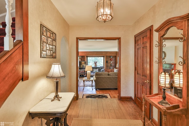 2711 Main St, Bethlehem, PA 18017 - corridor featuring hardwood / wood-style floors, arched walkways, and a chandelier