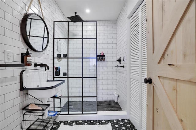 9379 Fairmount Way, Tobyhanna, PA 18466 - bathroom with tile walls, a shower stall, a closet, and tile patterned flooring