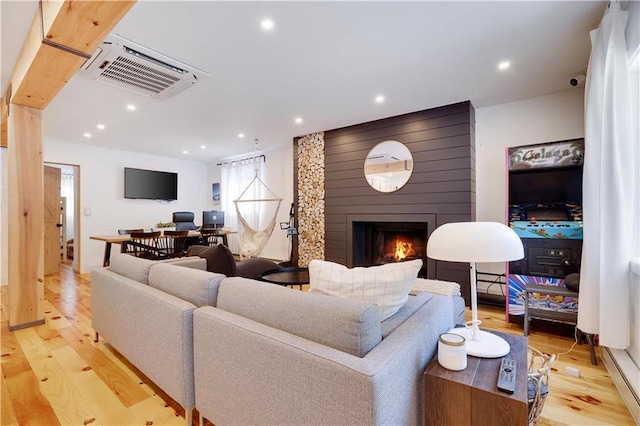 9379 Fairmount Way, Tobyhanna, PA 18466 - living room featuring light wood-style floors, a fireplace, and recessed lighting