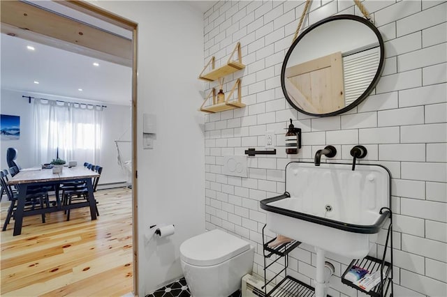 9379 Fairmount Way, Tobyhanna, PA 18466 - bathroom featuring tile walls, baseboard heating, recessed lighting, and wood finished floors