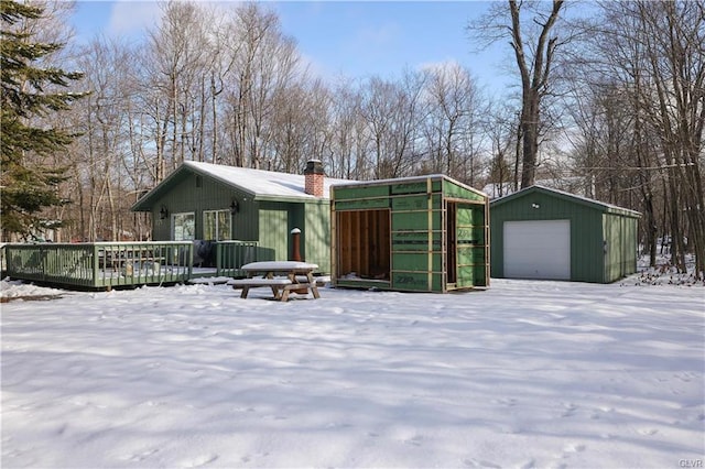 9379 Fairmount Way, Tobyhanna, PA 18466 - view of front of house with a chimney, a garage, an outdoor structure, and a deck