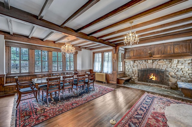 24 Summit Ave, Pocono Summit, PA 18346 - dining room featuring a wainscoted wall, radiator, hardwood / wood-style flooring, and a chandelier