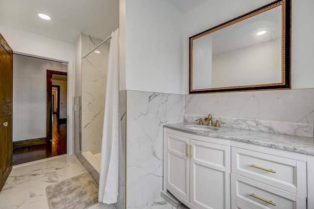 24 Summit Ave, Pocono Summit, PA 18346 - bathroom with vanity, a marble finish shower, tile walls, recessed lighting, and marble finish floor