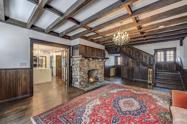 24 Summit Ave, Pocono Summit, PA 18346 - living area featuring a wainscoted wall, hardwood / wood-style flooring, stairway, and a chandelier