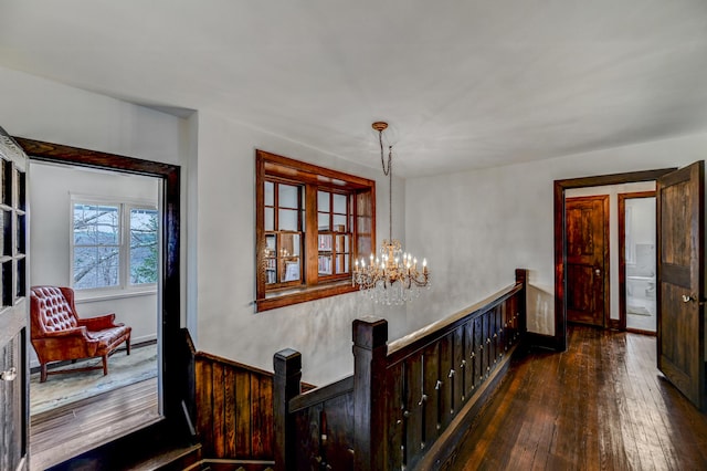 24 Summit Ave, Pocono Summit, PA 18346 - hall featuring an upstairs landing, a chandelier, and hardwood / wood-style flooring