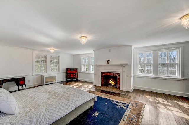 24 Summit Ave, Pocono Summit, PA 18346 - bedroom with wood-type flooring, baseboards, and a fireplace