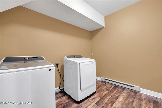 washroom with baseboard heating, independent washer and dryer, wood finished floors, and laundry area