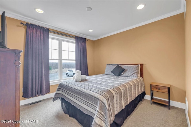 carpeted bedroom featuring recessed lighting, visible vents, baseboards, and crown molding