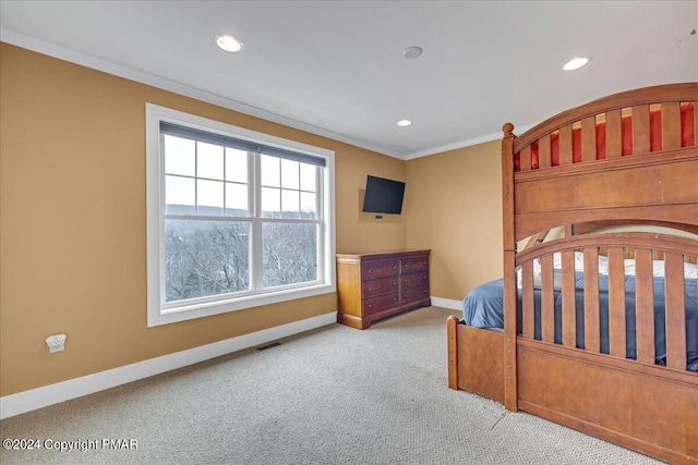 carpeted bedroom with visible vents, recessed lighting, baseboards, and ornamental molding