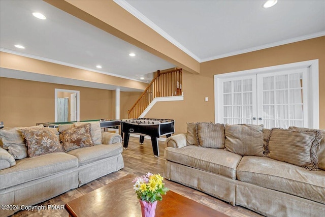 living area with billiards, wood finished floors, recessed lighting, stairway, and crown molding